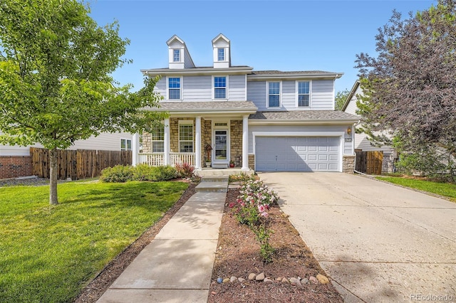 15649 E 7th Cir, Aurora, CO 80011 - traditional-style home featuring covered porch, an attached garage, stone siding, and driveway
