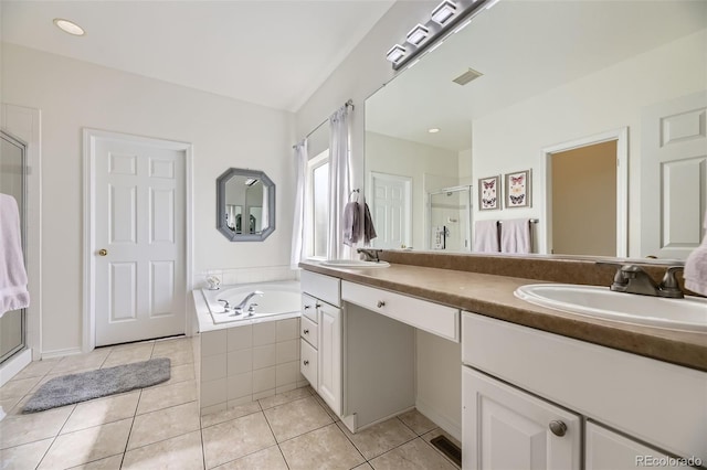 15649 E 7th Cir, Aurora, CO 80011 - full bathroom with double vanity, a stall shower, a garden tub, and tile patterned flooring