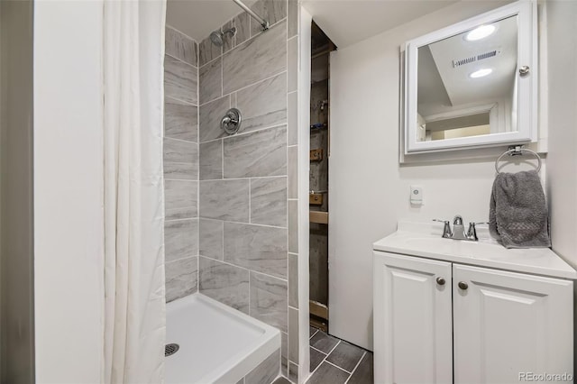 15649 E 7th Cir, Aurora, CO 80011 - bathroom featuring vanity and a tile shower