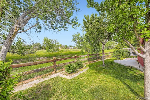 15649 E 7th Cir, Aurora, CO 80011 - fenced backyard with a patio area