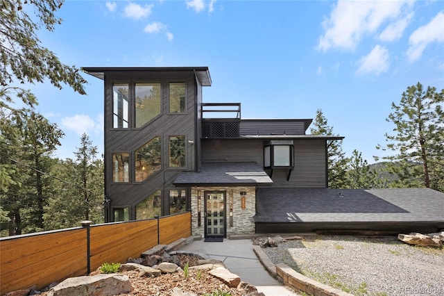 4477 Independence Trl, Evergreen, CO 80439 - contemporary home with stone siding and a shingled roof