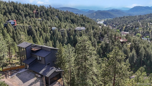 4477 Independence Trl, Evergreen, CO 80439 - view of subject property with a forest and a mountain backdrop