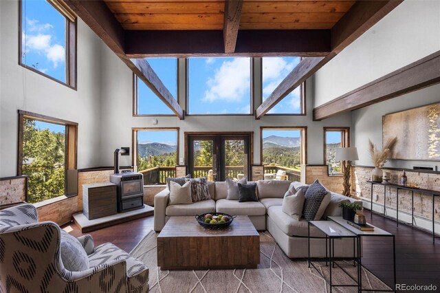 4477 Independence Trl, Evergreen, CO 80439 - living room with a mountain view, hardwood / wood-style flooring, a high ceiling, and a wood ceiling with exposed beams