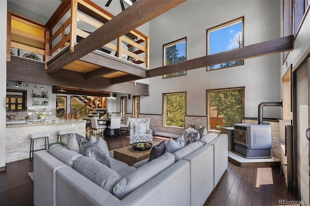 4477 Independence Trl, Evergreen, CO 80439 - living room with stairway, hardwood / wood-style flooring, a towering ceiling, and beam ceiling