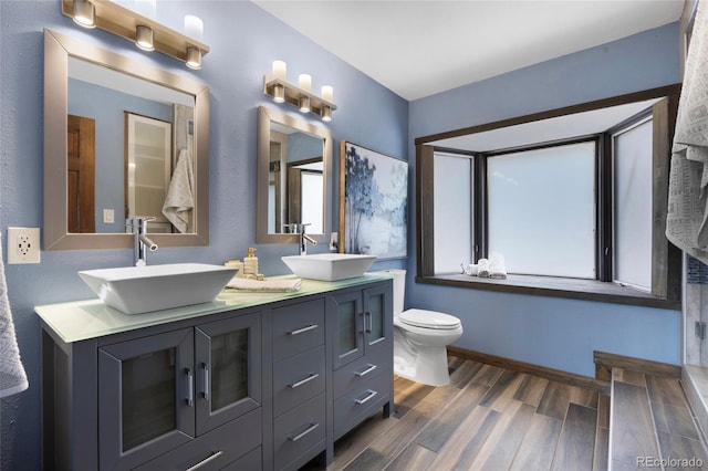 4477 Independence Trl, Evergreen, CO 80439 - full bathroom featuring wood finished floors and double vanity