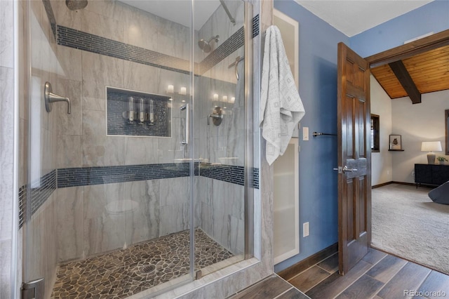 4477 Independence Trl, Evergreen, CO 80439 - bathroom with wood finished floors, ensuite bathroom, a shower stall, and a wooden ceiling with exposed beams