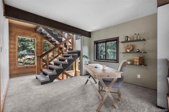 4477 Independence Trl, Evergreen, CO 80439 - carpeted dining room with plenty of natural light, wood walls, and stairway