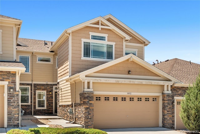 14892 E Poundstone Dr, Aurora, CO 80015 - craftsman inspired home featuring driveway, stone siding, and roof with shingles