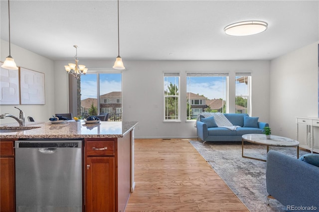 14892 E Poundstone Dr, Aurora, CO 80015 - kitchen with stainless steel dishwasher, open floor plan, and healthy amount of natural light