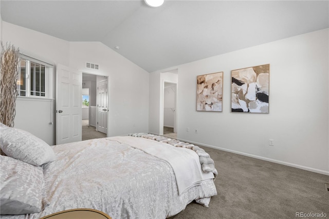 14892 E Poundstone Dr, Aurora, CO 80015 - bedroom featuring carpet flooring, vaulted ceiling, and a walk in closet