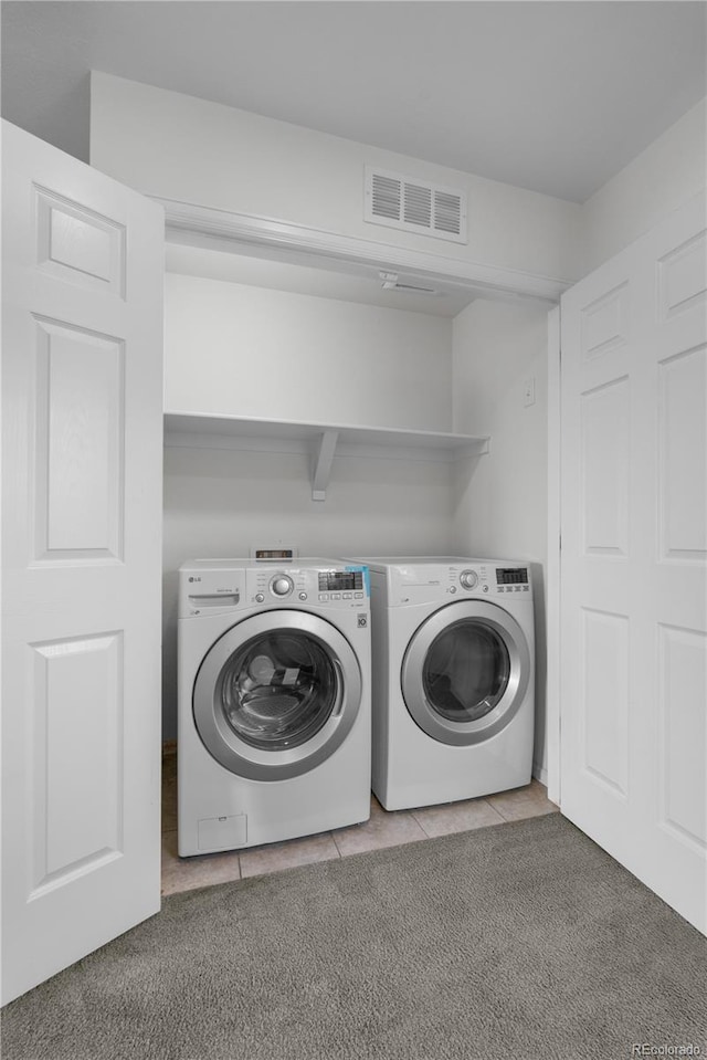 14892 E Poundstone Dr, Aurora, CO 80015 - laundry room with separate washer and dryer and light tile patterned floors