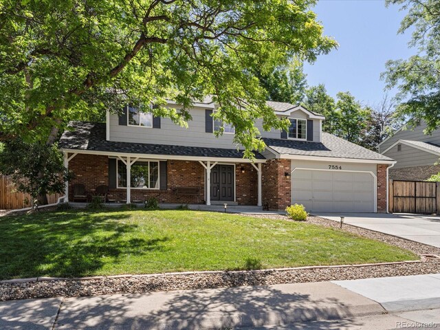 7554 S Ogden Way, Centennial, CO 80122 - traditional-style home featuring concrete driveway, brick siding, a porch, and a shingled roof