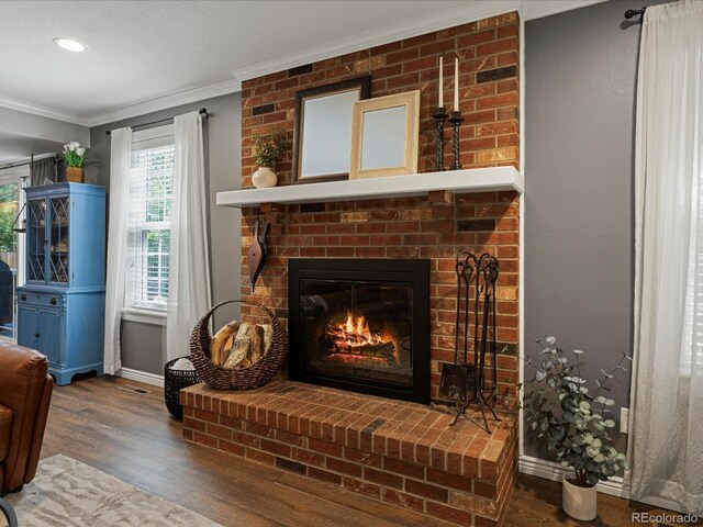 7554 S Ogden Way, Centennial, CO 80122 - living room with ornamental molding, a brick fireplace, wood finished floors, and recessed lighting