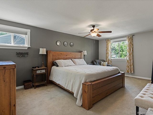 7554 S Ogden Way, Centennial, CO 80122 - bedroom with light colored carpet and ceiling fan