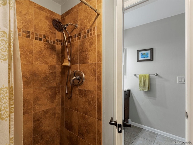 7554 S Ogden Way, Centennial, CO 80122 - bathroom with tile patterned floors, a tile shower, and vanity