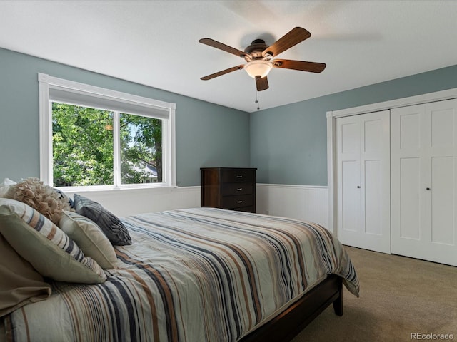 7554 S Ogden Way, Centennial, CO 80122 - carpeted bedroom with wainscoting, a closet, and a ceiling fan
