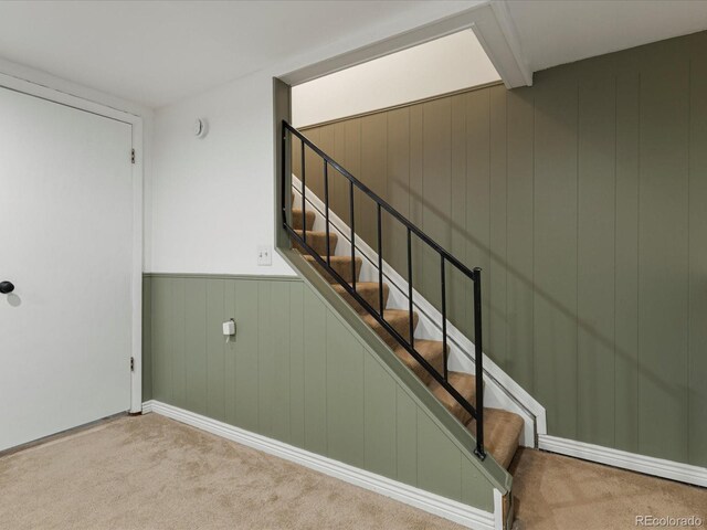 7554 S Ogden Way, Centennial, CO 80122 - stairs with carpet flooring, wood walls, and wainscoting