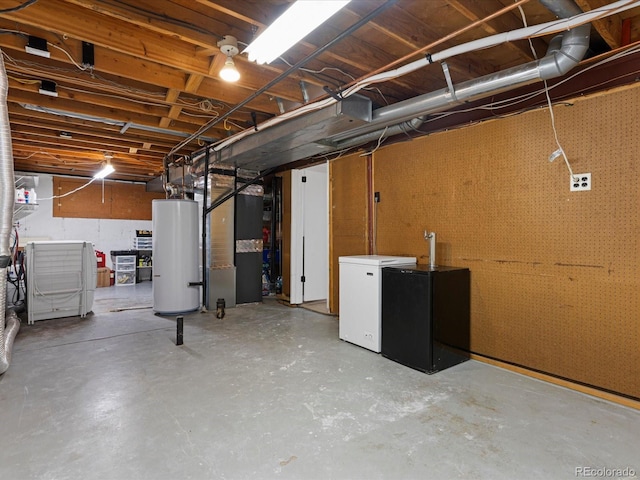 7554 S Ogden Way, Centennial, CO 80122 - unfinished below grade area featuring gas water heater, fridge, heating unit, and black refrigerator