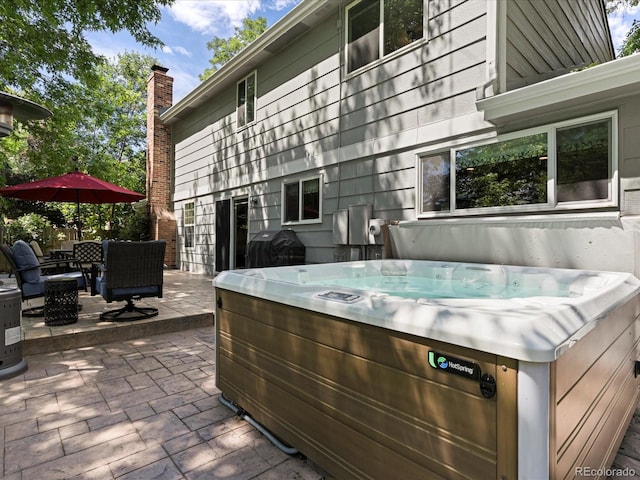 7554 S Ogden Way, Centennial, CO 80122 - view of patio featuring a hot tub