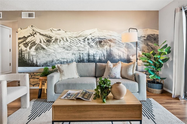 interior space featuring a textured ceiling and hardwood / wood-style floors