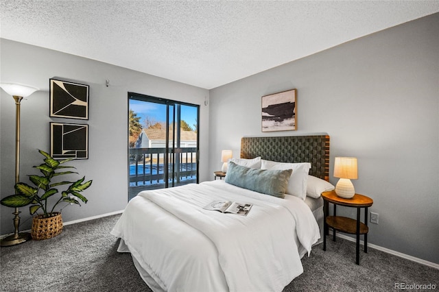 bedroom with a textured ceiling, dark colored carpet, and access to exterior