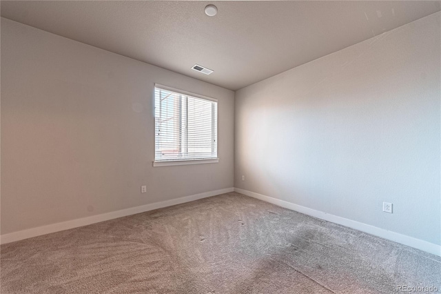 unfurnished room with carpet flooring