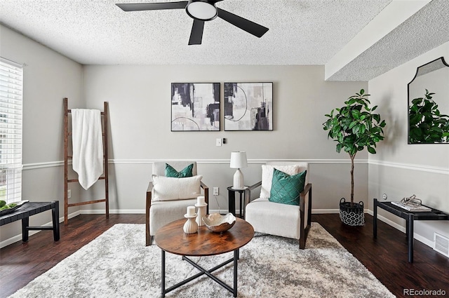 2113 Coronado Pkwy Unit B, Denver, CO 80229 - sitting room with a textured ceiling, wood finished floors, a ceiling fan, healthy amount of natural light, and baseboards