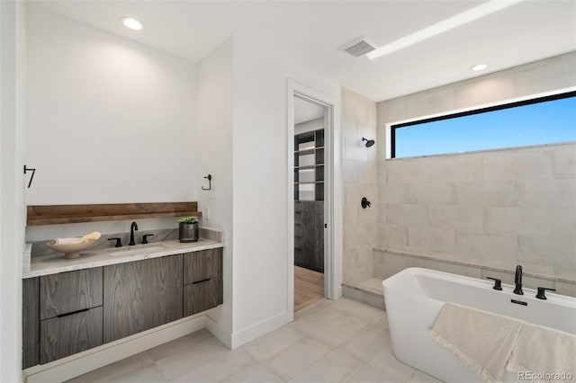 bathroom with vanity and plus walk in shower