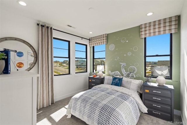 bedroom with light colored carpet