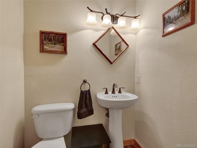 bathroom with toilet and sink