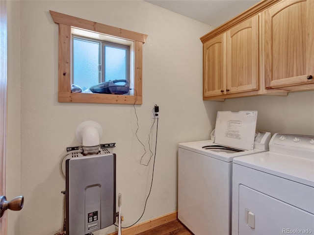 washroom with cabinets and washer and dryer