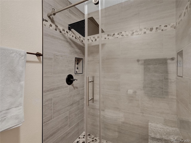 bathroom featuring an enclosed shower