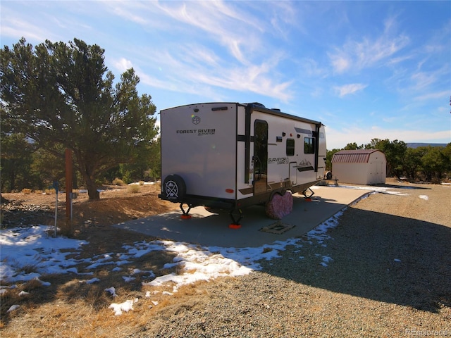 exterior space with a storage shed