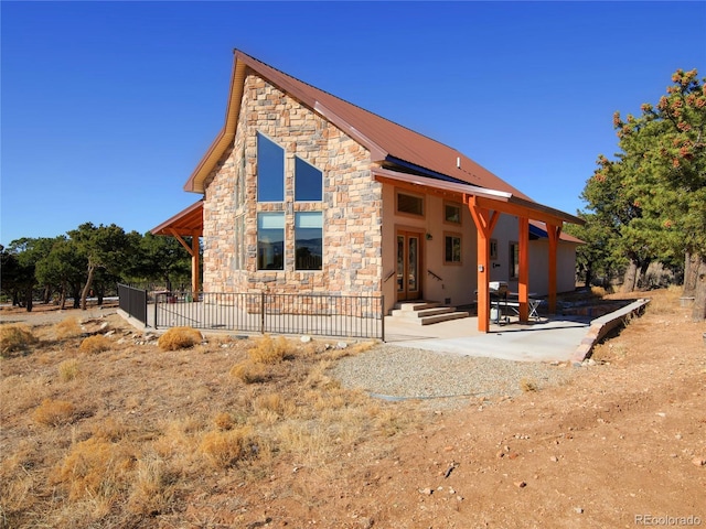 rear view of house featuring a patio