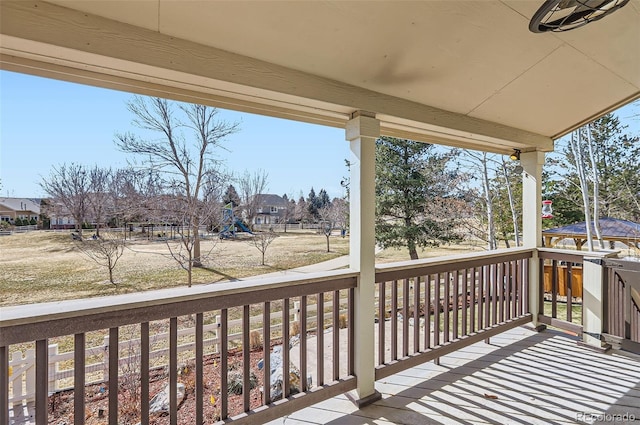 wooden deck with a porch and a residential view