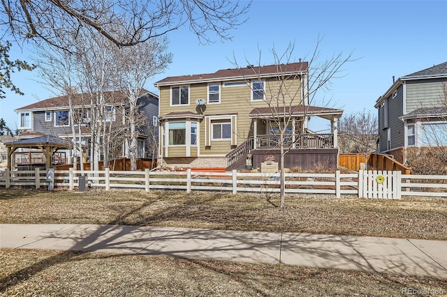 view of front of property featuring a gazebo and a fenced front yard