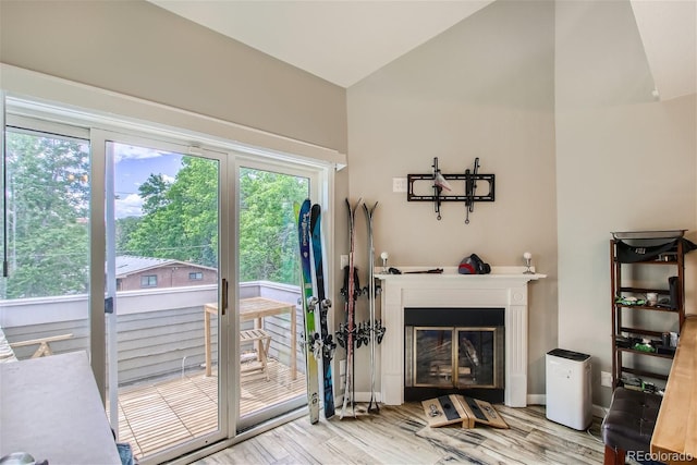 living room featuring vaulted ceiling and hardwood / wood-style floors