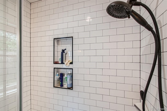 bathroom with a tile shower