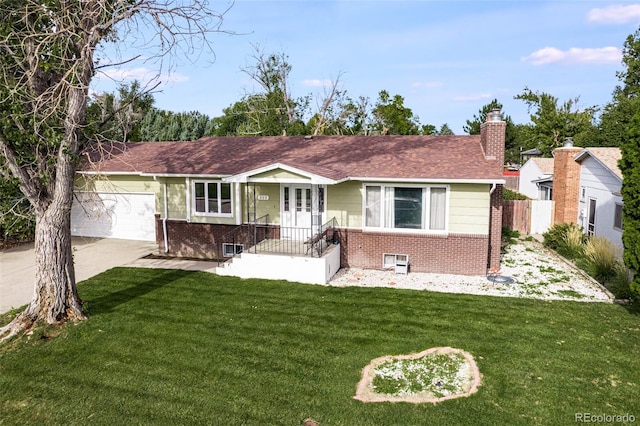 ranch-style home with a front yard and a garage