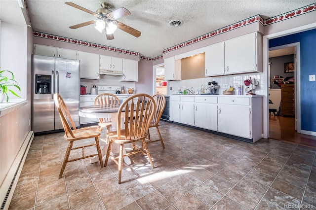 kitchen featuring ceiling fan, white cabinets, a textured ceiling, stainless steel fridge with ice dispenser, and a baseboard radiator