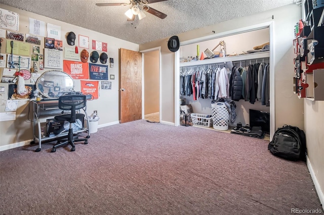 carpeted office space with ceiling fan and a textured ceiling