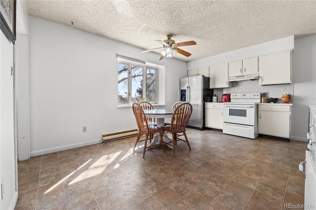 kitchen featuring electric stove, decorative backsplash, baseboard heating, stainless steel fridge, and under cabinet range hood