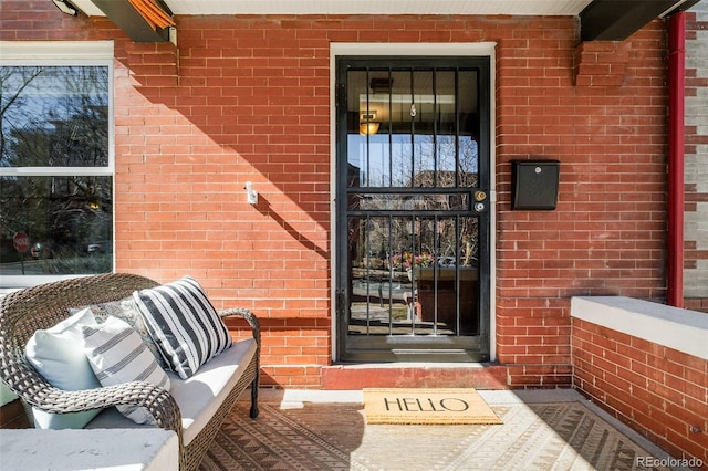 entrance to property with brick siding