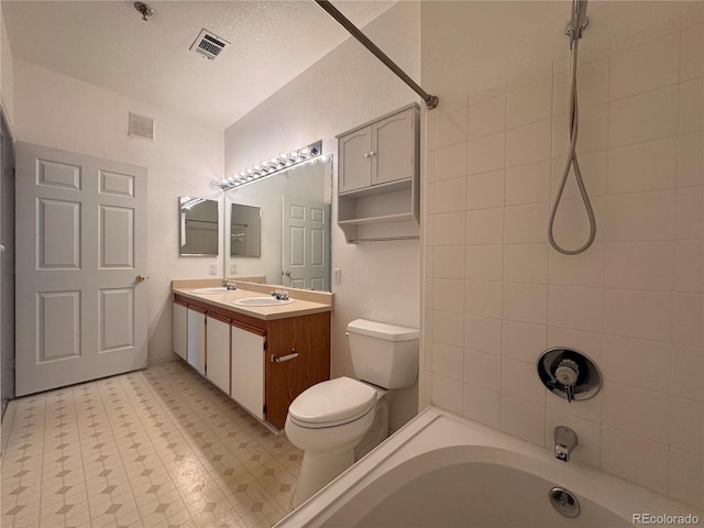bathroom with visible vents, a sink, bathtub / shower combination, and toilet
