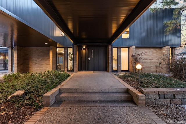 property entrance with brick siding