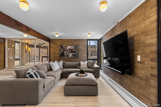 living area with a wall of windows, a baseboard heating unit, beamed ceiling, and brick wall