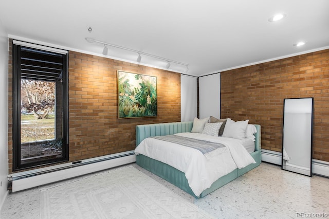 bedroom featuring recessed lighting, brick wall, and a baseboard radiator