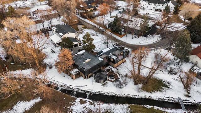 snowy aerial view featuring a residential view