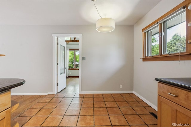 2901 Lorraine Ct, Boulder, CO 80304 - unfurnished dining area with baseboards and light tile patterned floors
