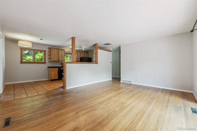 2901 Lorraine Ct, Boulder, CO 80304 - unfurnished living room with light wood-style flooring and baseboards